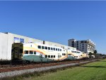 Sunrail Train # P313 heads south out of Downtown Kissimmee with Bombardier Bilevel Cab Car # 2008 doing the honors